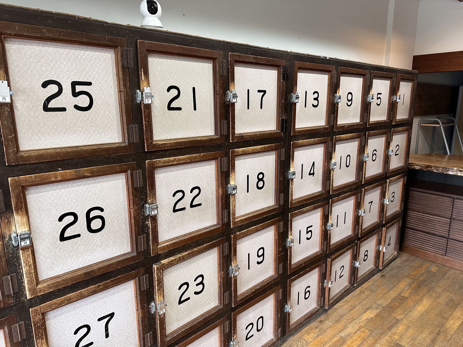 A photo of a series of cupboard doors, each of them has a number on them. 